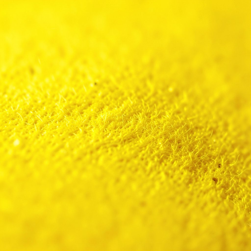 A circular emblem in warm mustard gold featuring a stylized transport motif, set against a dark gradient background.